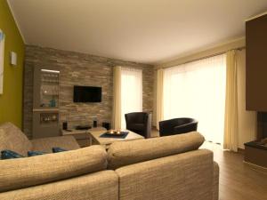 a living room with a couch and a table at Casa Leonardo in Göhren-Lebbin