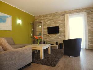 a living room with a couch and a table at Casa Leonardo in Göhren-Lebbin