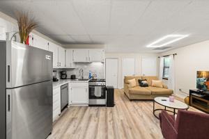 a kitchen and living room with a stainless steel refrigerator at Pigeon Forge Home in Pigeon Forge