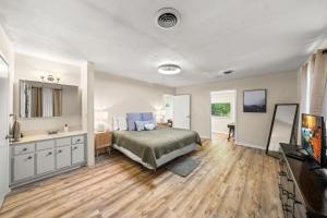 a bedroom with a bed and a sink at Pigeon Forge Home in Pigeon Forge