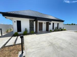 a rendering of a house with a driveway at Bure 30 Luxury Villa in Nadi