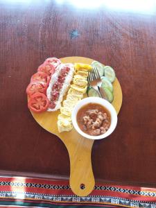 a plate of food with a bowl of soup and vegetables at Baywatch Camp in Nuweiba +74 photos