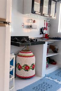 a kitchen with a counter with a crocheted bag on it at Casa em salinas in Salinópolis