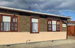 a building with windows on the side of it at MI HOGAR ES TUYO in Punta Arenas