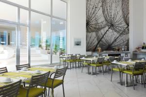 Restoran ili drugo mesto za obedovanje u objektu Krystal Urban Cancun & Beach Club