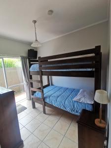 a bedroom with two bunk beds in a room at Reefton in Reefton