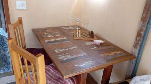a wooden table with a chess set on it at Cabana Jandaia in Teresópolis