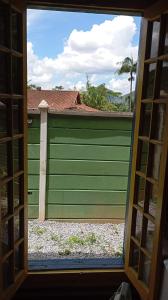 a view of a garage door through a window at Cabana Jandaia in Teresópolis