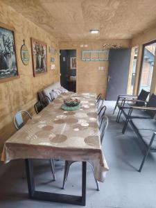 a dining room with a table and chairs at Hostal Egaña 228 in Puerto Montt