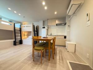a kitchen and dining room with a table and chairs at PRISM Inn Ikegami Kamata in Tokyo