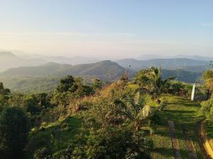 a view of a valley with mountains in the background at Tranquil Edge Villa in Haputale