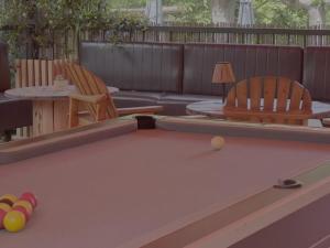 a pool table with two chairs and a couch at Mobil-home 4 pers avec terrasse - API-1-52-1663 in Espira-de-Conflent +28 photos