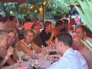 a group of people sitting at a table in a restaurant at Mobil-home 4 pers avec terrasse - API-1-52-1663 in Espira-de-Conflent