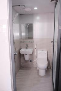 a bathroom with a toilet and a sink at 5H homestay & Motorbikes For Rent in Hue