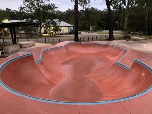 a skate park with a skateboard ramp in a park at Beach house in Hallidays Point +7 photos