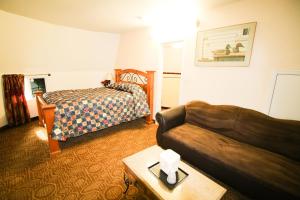 Un ou plusieurs lits dans un hébergement de l'établissement Wigwam Motel