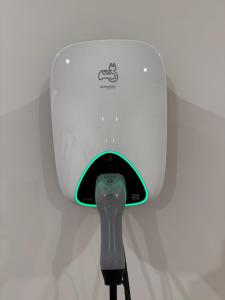 a white toaster hanging on a wall at Rawson Retreat - Spa, EV outlet and Premium Luxury in Jindabyne +24 photos