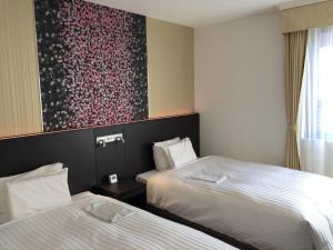 Una cama o camas en una habitación de Hotel Mets Nagaoka