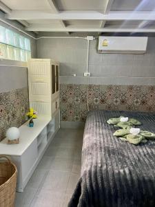 a bedroom with a large bed in a room at House & Spa Tropical Home with Private Jacuzzi Koh Phangan in Ko Phangan