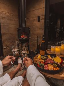 a group of people sitting around a table with wine glasses at The Rise, Ben Ohau in Twizel +25 photos