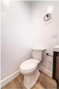 a bathroom with a white toilet and a sink at Stellar Sherman Oaks One Bedroom close to Universal Studios in Burbank