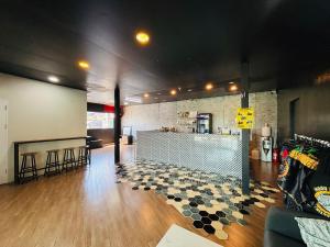 a large room with a counter and a bar at 1715 House - White Rhino in Rawai Beach