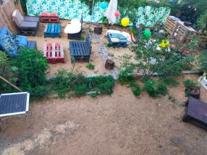 an aerial view of a backyard with a toy garden at Octavie in Villeurbanne