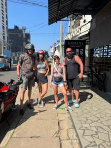 a group of people standing on a sidewalk at Seaport Negombo in Negombo