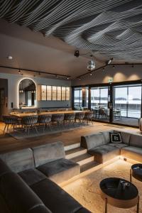a living room with a couch and a table at Pellinge Marina in Porvoo