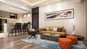a living room with a couch and a table at SureStay by Best Western in Cox's Bazar