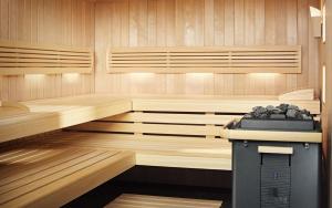 a sauna with wood paneled walls at Amphora Hotel & Suites in Paphos