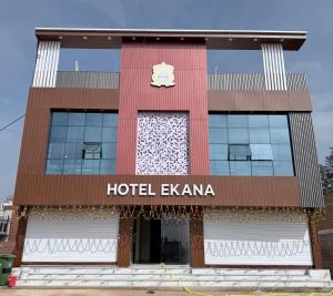 a hotel iguana building with a sign on it at Hotel Ekana in Chhatarpur