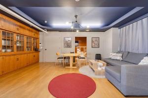a living room with a couch and a table at LINKAGE STAY Chitose Funabashi in Tokyo