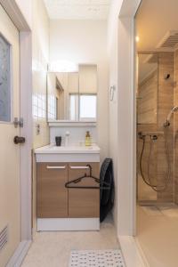 a bathroom with a sink and a shower at LINKAGE STAY Chitose Funabashi in Tokyo +66 photos