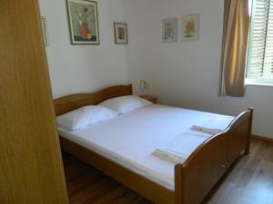 Ένα ή περισσότερα κρεβάτια σε δωμάτιο στο Apartment Katarina