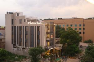 a view of a building with a sign on it at Hotel Grand Empire, Banquet, Swimming Pool with Taj View in Agra