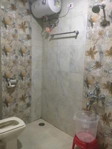 a small bathroom with a toilet at Aurum Abodes in Hyderabad