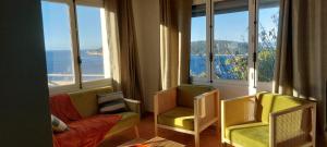 a living room with a view of the ocean at CAP AZUR ILE du LEVANT in Île du Levant