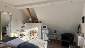 a bedroom with a bed and a fireplace at Ferienhaus Thale in Braunlage