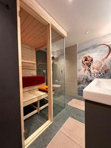 a bathroom with a red tub and a sink at VizslaVilla in Poroszló +51 photos