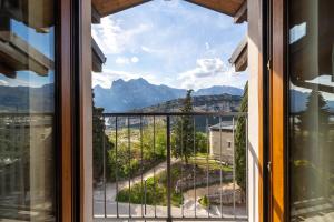 a window with a view of a mountain view at Appartamento Al Forte e Appartamento Orizzonte59 in Nago-Torbole