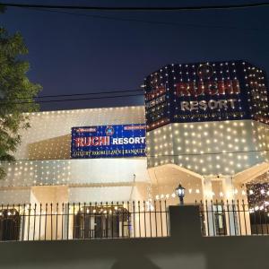 a building with lights on it at night at Ruchi resort in Hisār +41 photos