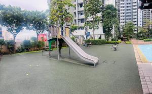 a playground with a slide in a park at New 1BR in Mandaluyong 40SQM in Manila
