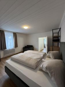 a bedroom with two beds and a ladder at rooms11 in Salzburg