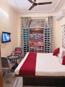 a bedroom with a bed and a dining room at Angel paradise in Jaipur