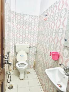 a bathroom with a toilet and a sink at Angel paradise in Jaipur