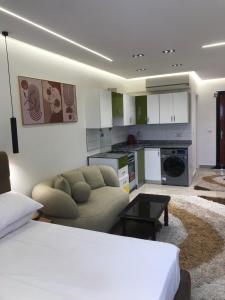 a living room with a couch and a kitchen at The view resort nabq in Sharm El Sheikh