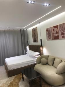 a hotel room with a bed and a couch at The view resort nabq in Sharm El Sheikh +13 photos