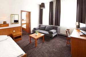 TV a/nebo společenská místnost v ubytování Hotel Jensen