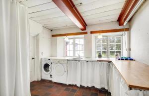 a laundry room with a washer and dryer in it at BeBaBopS Homestay Sønderborg in Sønderborg